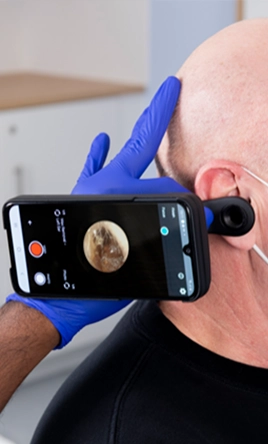 Earwax removal and syringing using microsuction