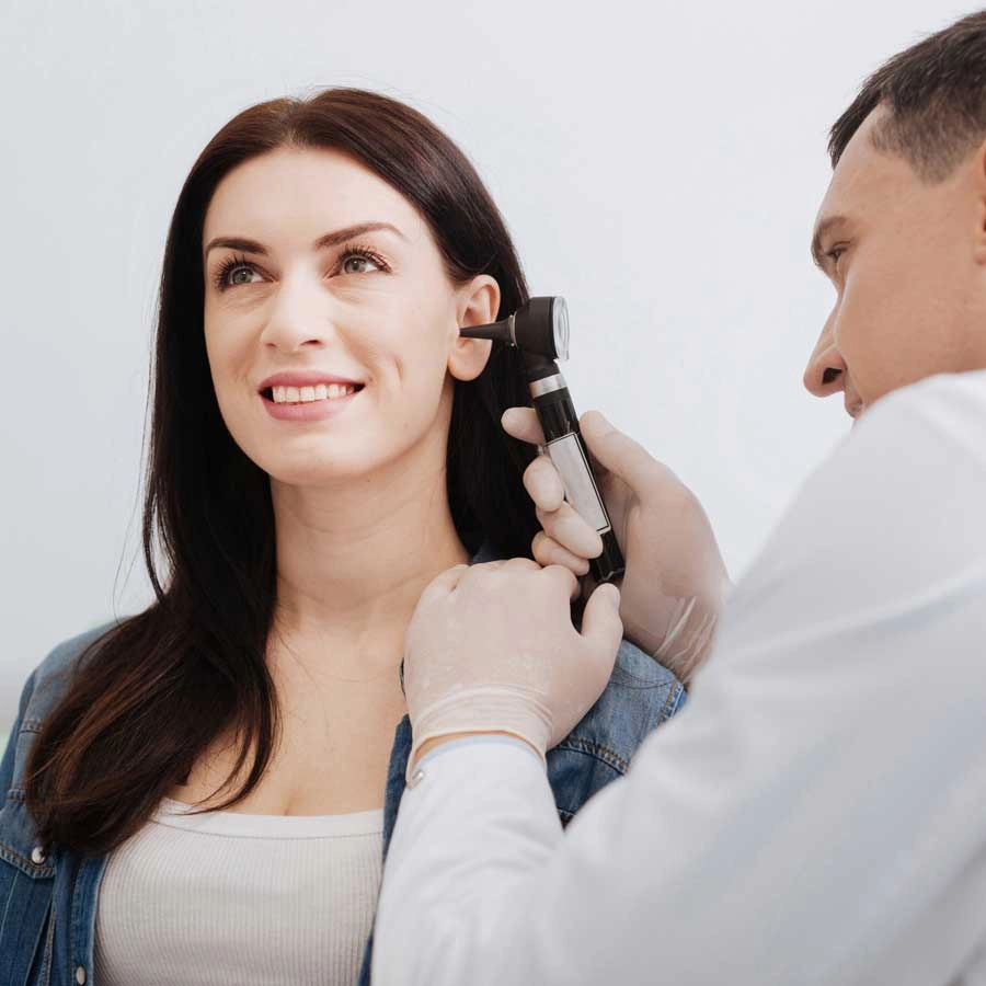 Pretty lady and her Ears being examined for wax and infections