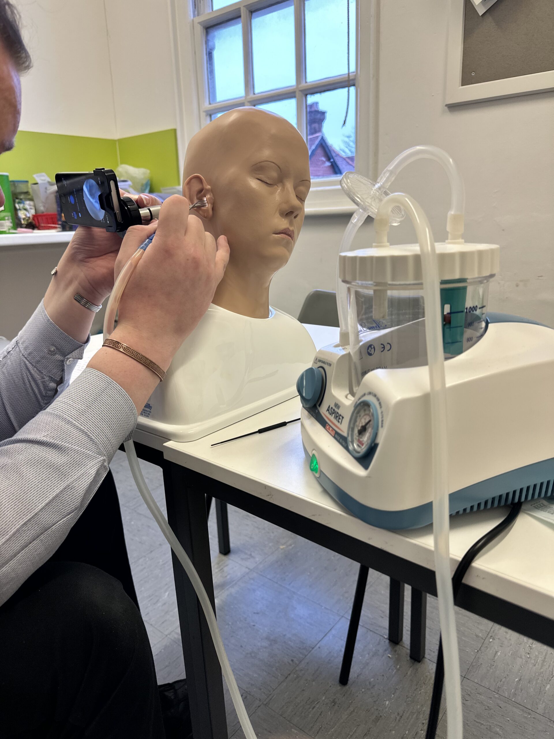 Close up of microsuction equipment used to train students on earwax removal via microsuction